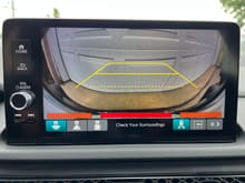 You can overlay the rear sensors on the backup camera screen
