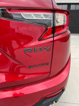 Carbon fiber coated emblems from Deep Blue chrome