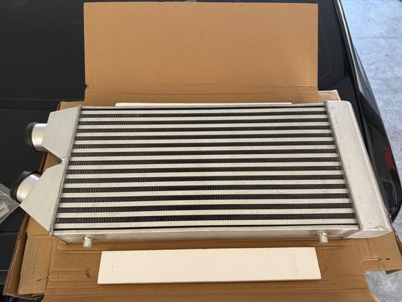 I bought this intercooler but not sure if I'm going to use it. I am undecided if I want to use a air to water intercooler instead.