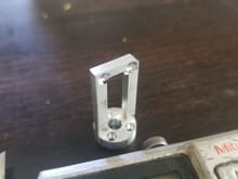 This is the finished part... The slot is next to the counter sunk tapped holes.. part is approx 1/2" x 1".. 6061 aluminum.. Not a lot of chips
