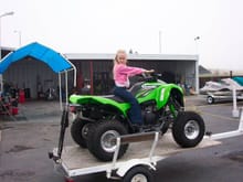 The money has been paid, the V is loaded. Ready to go home and try it out. Get off my new quad you little brat!!!