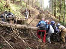 Puget Sound Area Riders working together. No obstacle is too tough for a group of good friends (with strong backs).                                                                                     