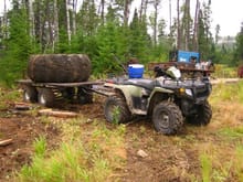 05 and trailer with skidder tire                                                                                                                                                                        