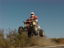 Me jumping a table top on our MX track right behind the house.                                                                                                                                          