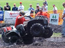 I'm all for helping out the ATV cause... This is State Representitive, Dan Doorman wheelying my quad out of the mud pit during an expedition run