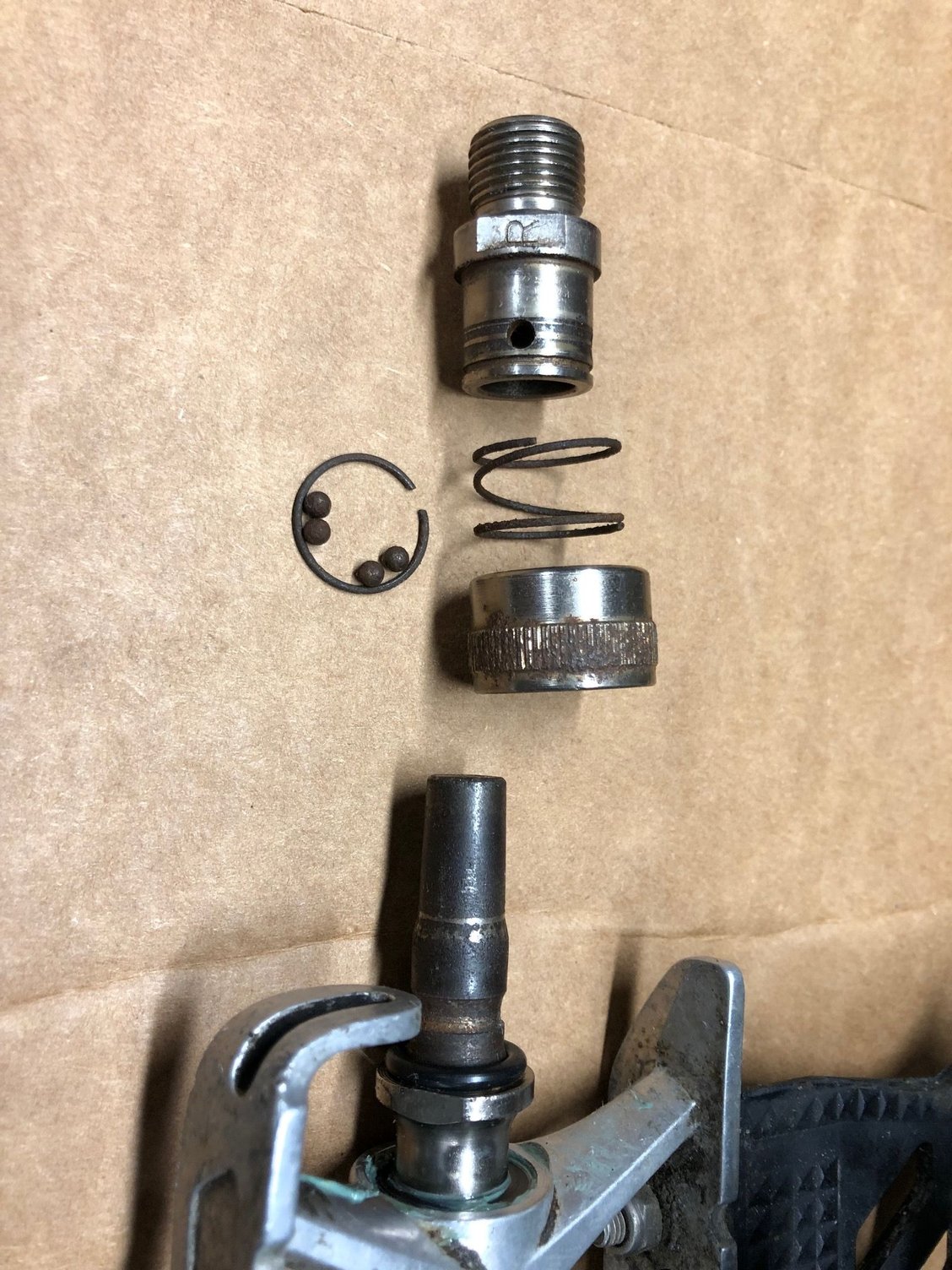 Heres a coupler disassembled. This is easy to do by removing a circlip (seen here enclosing the 4 retaining ball bearings). If the balls get too rusty, they can be replaced.
