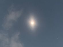 A crappy photograph that utterly fails to capture the amazing sight of a completely obscured sun and exposed corona