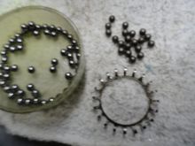 old bearings on the right side new bearings on the left and empty cage after cleaning