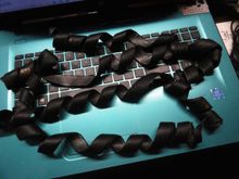 This is the leather wrap from four golf grips.  It is more than you will need for your grip project.   This leather is infused with paraffin to make it waterproof.  You can use a bit of rubber cement to make it stay put when wrapping and it should hold the grip wrap in place.  