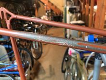 Original pewter paint underneath cheap coat.