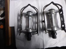 The cages are steel and could use a good coat of black paint, and the spindles are I think in fine shape.  It appears that one has been overhauled recently and the other needs some love.  But the price of admission is the cost of postage, probably ten bucks.