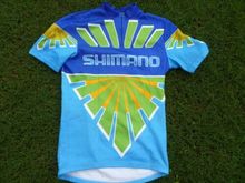 Includes yellow, green is different shade, dissimilar pattern, no Dura Ace branding.