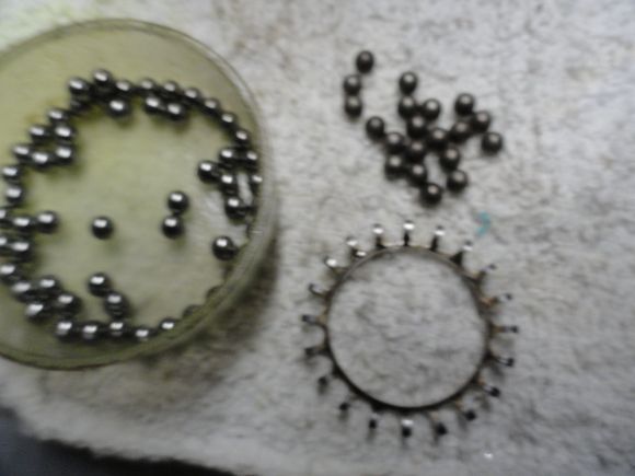 old bearings on the right side new bearings on the left and empty cage after cleaning