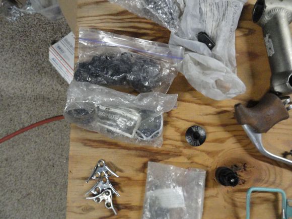 4 broken and non-functioning cyclo-computers, toe clips for 600 pedals single items like top cap and brake lever