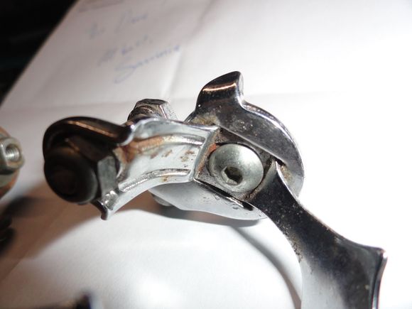 The plates must have detached and the parts were secured with a bolt from the inside.  Pretty sketchy but it might work if you can't get another band.  It is in the spare parts bin now.