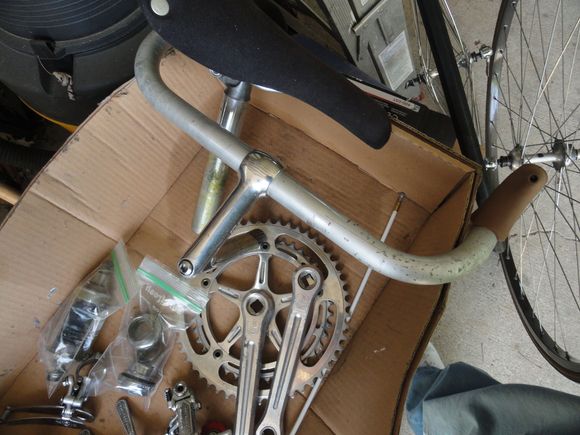 The bars, stem, and seat assembly with the wheels on the side