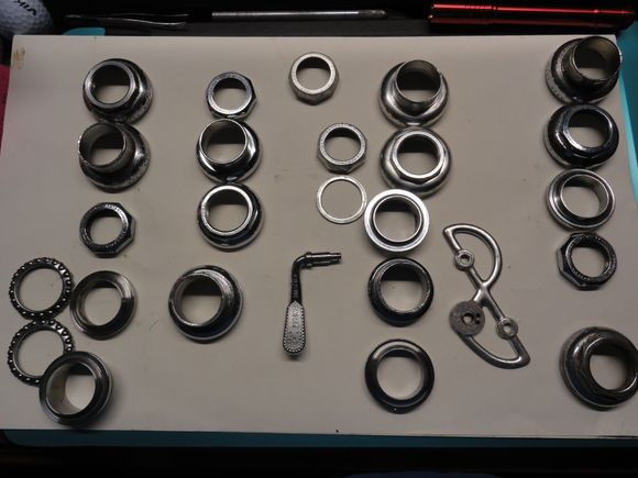Headset parts with a couple of loose items that came with them.  About six of the race assemblies will go to the chrome platers for restoration.  It will drive the cost up a bit but they will be correct and pretty shiny when done.