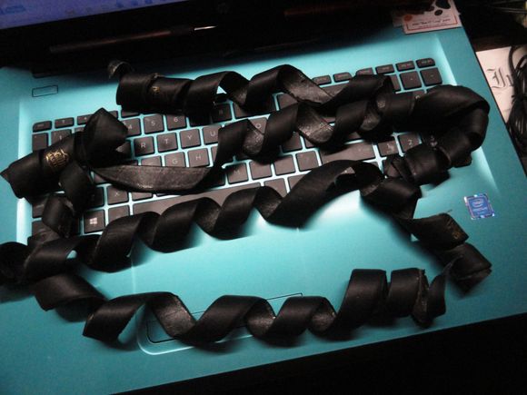 This is the leather wrap from four golf grips.  It is more than you will need for your grip project.   This leather is infused with paraffin to make it waterproof.  You can use a bit of rubber cement to make it stay put when wrapping and it should hold the grip wrap in place.  