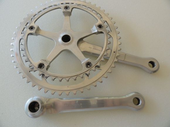 You can see a mark from an over-shift on the drive side, and a bit of dirt on the spindle holes.   Size is 175 that you can see on the arms.