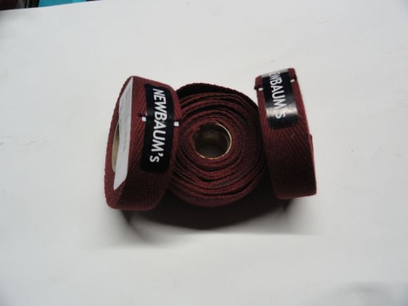 Two rolls of maroon tape and some lightly used wide tape.