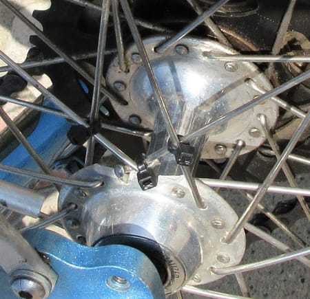 Cracked rear hub with zip tied spokes
