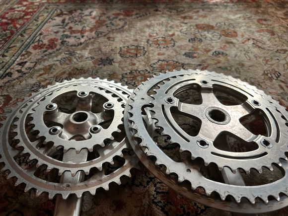 Specialized on the left.  You can see the “bump” that pushes the middle and outer chainrings out 5-7 mm.