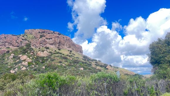 There was a chance of rain early, but it turned out to be a beautiful day, with the hills showing off their cloaks of verdant green against striking rock formations and vibrant blue and white skies.