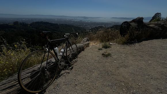View looking down Claremont descent with a peek-a-boo view of SF.