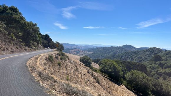 I
Passing through a picturesque connector road that has sections of dirt roads and closed to through car traffic. 