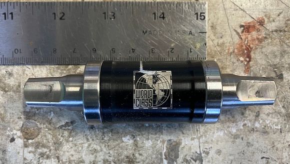 Barrel width is only 58mm, so with the Phil Wood mounting rings I checked it with, the total width is 66mm