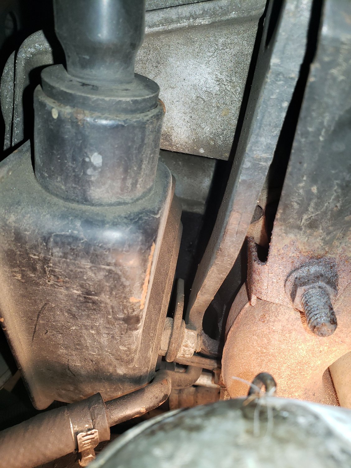 View of the backside of the power steering pump. There was a fitting that was hard to reach on the back side.