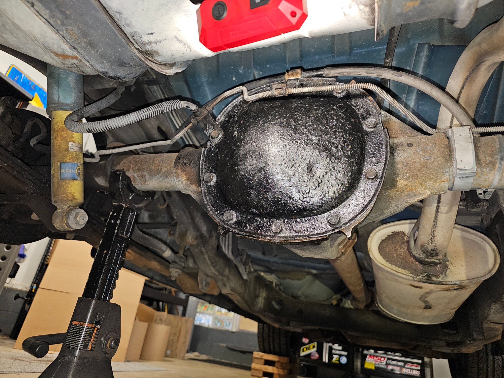 New diff seal with RTV on one side of the gasket, as well as on the bolts. Really wanted to buy a different cover, but it wasn't in the budget at the time. 
