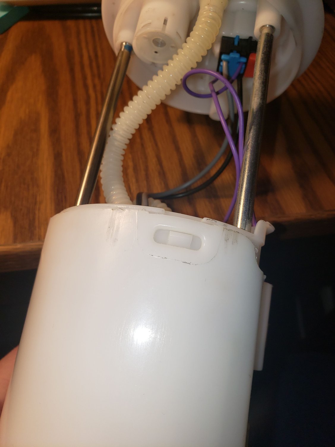 Dirt on the outline of the molding and a scrape at the top (on the right) of the lower body of the assembly.