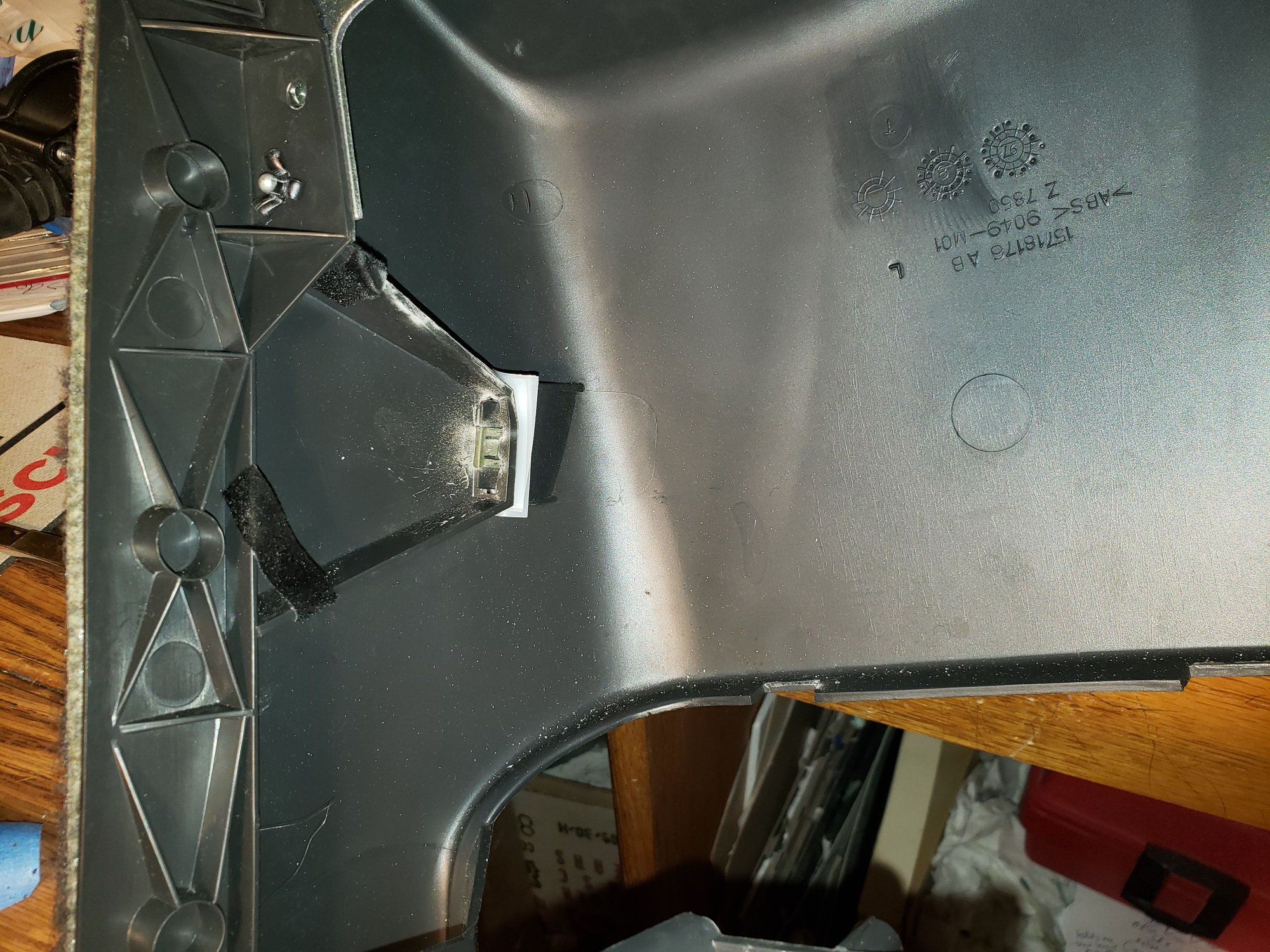 The shims that are easier to see  between the skirt and the main part of the console