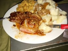 Steak with fried onions, stuffing and potatoes. Steak was slow pan fried while basting with some Guiness BBQ sauce
