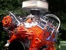 355 c.i., steel crank, TRW forged pistons, Pink Rods, double hump heads (64cc chambers, 2.02/1.64 valves, ported and polished, 7/16" screw in studs, roller rockers), Polished Eldebrock single plane intake, Holley 820 cfm double pumper w/ mechanical secondaries...all through long tube ceramic headers and 2 1/4" exhaust with Flowmasters...