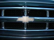 painted the mesh in the grill, everything behind it and repainted the chevy emblem, looks better.