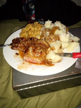 Steak with fried onions, stuffing and potatoes. Steak was slow pan fried while basting with some Guiness BBQ sauce