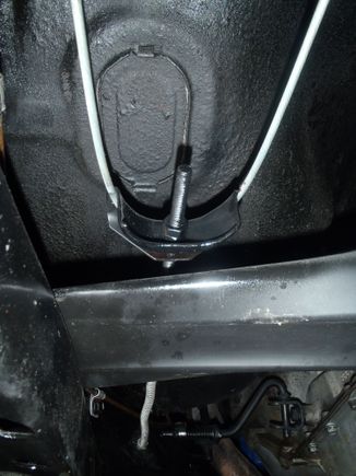 Front cable, equalizer bracket.  Drivers side cable.