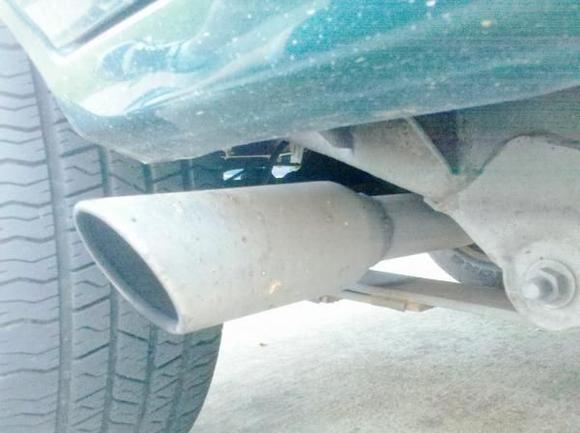 Old rear exit exhaust before the rear right tire. Changed this because exhaust was rattling between body and leaf spring. Very Dangerous