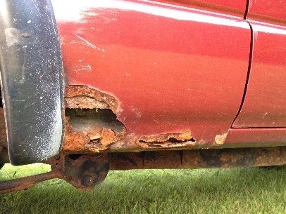 Rot in front of passenger side rear wheel.  The driver's side looked similar but not as severe.