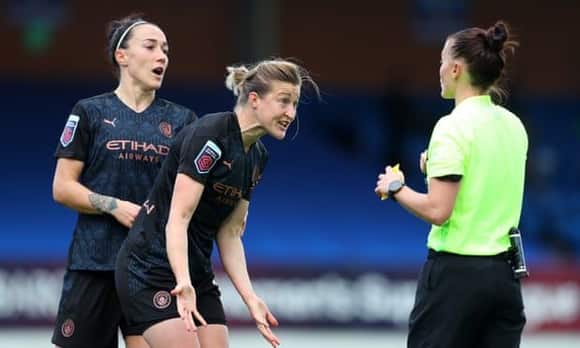 Manchester City’s Ellen White (centre) is pulled back by Lucy Bronze as she protests to referee Rebecca Welch against the penalty awarded against her. 