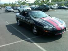 And there they are!  The ugly racing stripes!  Look people, I traded a Xtreme pick up for the camaro so i could have a car to put a child seat in, sure its a convertable but the truck was only the regular cab and didnt want to transport a child in the front seat.  I didnt have this car painted, it was originally silver, which to me would have looked a lot better then this crappy paint job.