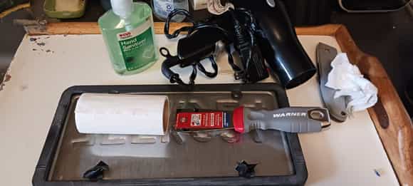 tools and residue of the peelings

moistened with hand sanitizer / alcohol, 

reverse side of lic plate and lic plate frame