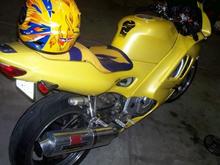 When I first got it including helmet. Tribal design on the seat black and yellow tank protector