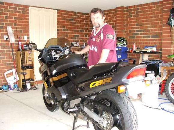 Me and my Baby note the missing exhaust....I have orderd a yoshimiru 4 int 1 system so messed around with the std system (removed rh/side exhaust and pluged and sealed the outlet, also trimmed about 6 inches off the other side) Got a very nice growl to her.