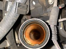 This is the inside of my oil tube.. the oil cap looks the same but kind of dried.. recently I checked my dipstick and saw bubbles and little bit of white stuff at the tip.. I haven’t had any engineer overheating, nor leaks, or loss of coolant! But I’m just curious on what is going on? I have a 2006 chevy tahoe 5.3 with 308k miles.. I recent had a code p0128 pop up! I do notice that the engine temp gauge in the car reads between 160 and 210!