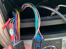This is the factory wiring harness for the stereo. On the left the two wires replaced were the right and left positive audio wires. When I connect these two plugs into my factory stereo no audio comes from the two front door speakers. So I’m thinking the issue resides in the factory harness. 