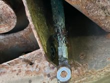 Attachment to the frame just behind the right passenger tire