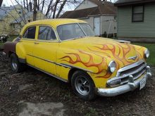 I have no idea why the back of the car is brown. The trunk lid is Yellow like the rest of the car, though